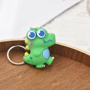 Porte-clés dinosaure dessin animé mignon avec anneau métal, pendentif silicone vert.