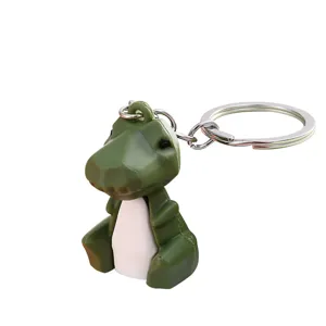 Cute pixel dinosaur keychain, 3D blocky PVC animal charm for car keys and backpack decor.
