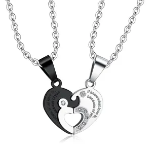 Detail of stainless steel heart puzzle pendants for couple necklaces with rhinestones.