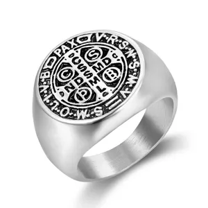 Macro detail of vintage Saint Benedict Medal engraving on stainless steel signet ring