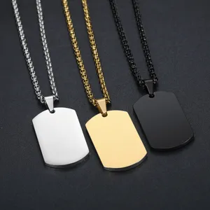 Detail view of three customizable stainless steel dog tag necklaces in silver, gold, and black