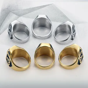 Detailed view of silver and gold Viking style titanium steel rings for men in hip hop design.