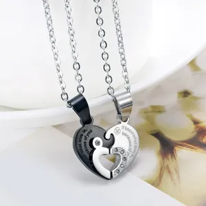 Close-up of interlocking heart puzzle necklace for couples in black and silver finish