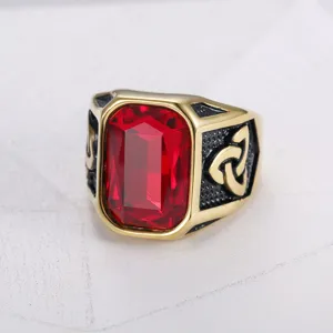 Detailed close-up of a men's Viking style ring featuring a large red gemstone center.