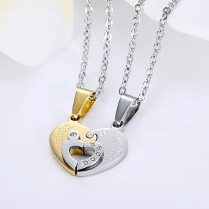 Detailed macro shot of interlocking heart puzzle couple necklaces in gold and silver.