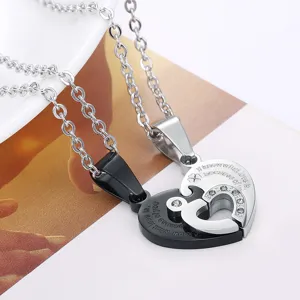Detail view of interlocking heart puzzle pendant necklaces with romantic engraving.