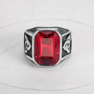 Detailed close-up view of a men's Viking ring with a large rectangular red gemstone