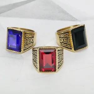 Three hip-hop punk rings with red, blue, and black gemstones in gold plating