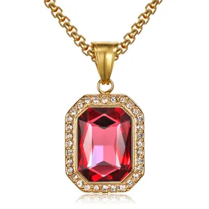 Close-up of elegant gold square red gemstone pendant necklace with crystal detailing