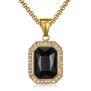 Close-up detail of a square black gemstone pendant with rhinestone halo on gold chain