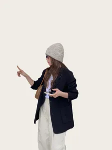 Women's woolen blend colorful thread knitted beanie hat for autumn and winter warmth.