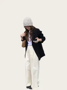 Wool blend colorful yarn knit beanie detail styling paired with classic black blazer.