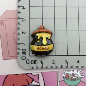 Resin honey pot detail charm, cute craft cabochon accessory for DIY phone case and handmade decor.