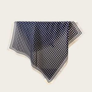Classic navy blue polka dot square silk scarf detail, elegant retro design for women neckwear.