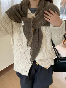 Cozy knit triangle scarf shawl detailed view, soft winter neck warmer accessory, casual outfit