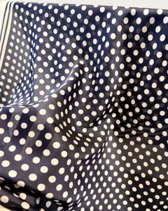 Classic navy blue polka dot square silk scarf detail, soft texture and elegant retro design for women.