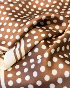 Brown white polka dot silk scarf detail texture close up elegant vintage neckerchief stylish