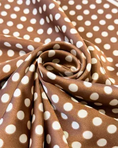 Brown polka dot silk square scarf detail shot, elegant fabric texture for women spring neck wear.