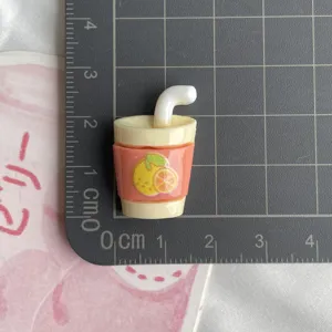 Resin orange drink cup miniature charm detail view, perfect for your phone case DIY decor.