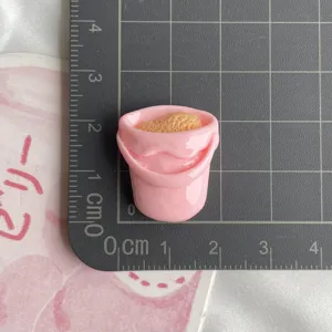 Resin pink bucket miniature charm detail view for DIY phone case craft and hair accessories