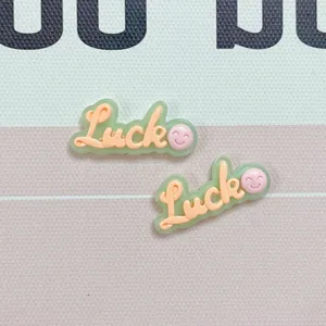 Resin jelly color Luck letter DIY accessories detail close-up for phone case decoration.