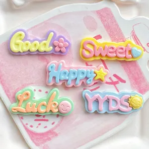 Resin alphabet letter charms with cute expressions, perfect for DIY phone cases and hair clips.
