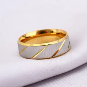 Two-tone brushed finish stainless steel ring with diagonal gold accents for men and women
