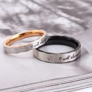 Pair of titanium steel rings with rhinestones and 'I will always be' engraving