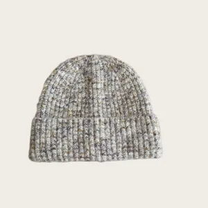 Detailed view of the women's wool blend colorful speckled knit beanie hat texture and soft cuff.