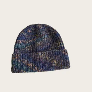 Detailed view of the multi-colored knitted woolen beanie, showing the unique speckled texture.