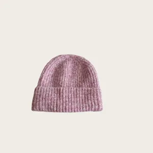 Close-up view of the cozy wool blend ribbed knit texture, showing fine colored yarn details.