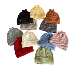 Koreanischer Stil süße Schleife Zopfmuster Strickmütze Winter warme Wollmütze für Damen