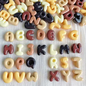 Mini resin alphabet charms in brown and beige tones, ideal for DIY phone case and craft projects.