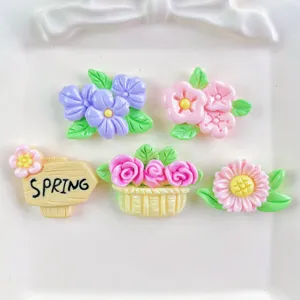 Colorful resin flower cabochons and spring sign detail for DIY phone case hairpins.