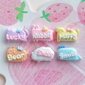 Resin animal charms with English words, detail view for DIY hair clips and phone cases.