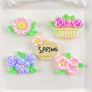 Resin spring flower and sign charms close-up detail, ideal for DIY phone case decoration.