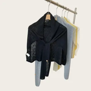 Black lightweight knit shawl detail, elegant summer neck scarf, minimalist solid color design.