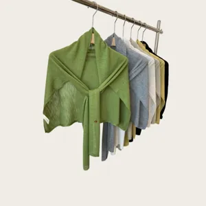 Lightweight summer knit shawl scarf on display rack, versatile cape for women wear.