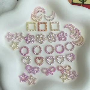 DIY pearl accessories close-up, mixed star moon heart shapes for handmade jewelry crafts.