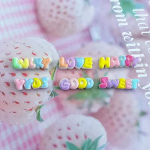 Resin alphabet letter beads detail view, perfect for DIY phone cases and hair clip crafting.