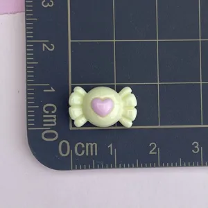 Mini yellow candy resin charm with pink heart for DIY nail art and cream glue border decoration