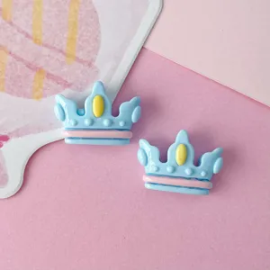 Glossy blue crown resin accessory detail view, perfect for custom DIY hair clips and crafts.