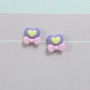 Mini resin heart bow charms for nail art and cute DIY hair clips crafting projects.