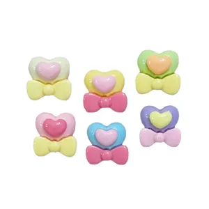 Cute mini resin heart bow charms for nail art crafts, cream glue and DIY hair clip decorations.