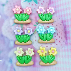 Resin flower cabochons detail shot, colorful floral charms for DIY crafts and phone cases.