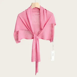 Close-up details of the summer pink knitted T-shaped shawl, lightweight and soft fabric.