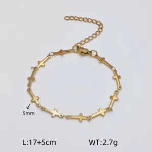 Gold stainless steel cross charm bracelet featuring an extension chain and clasp.