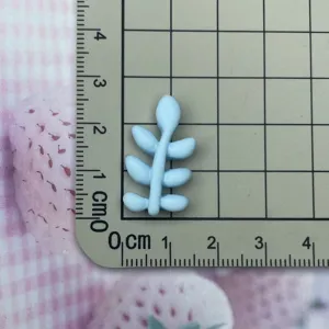 Blue resin leaf cabochon detail, smooth frosted craft charm for DIY phone case decor.
