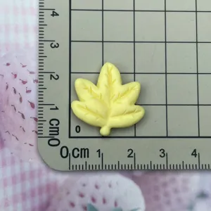 Yellow resin leaf charm flatback cabochon for DIY hair clips, phone cases, and jewelry making.