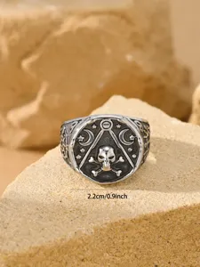 Close-up of vintage stainless steel skull pirate ring with dimension markings